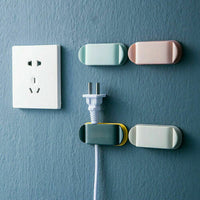 **(NET)**Adhesive Wall Mounted Power Socket Holder Wire Plug Organizer Hook 4 pcs